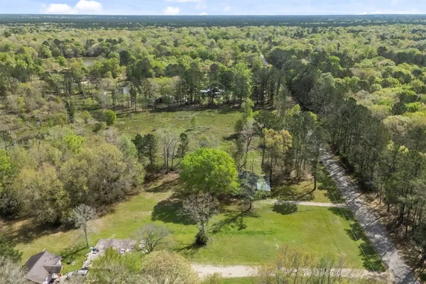 a view of a lake with a yard