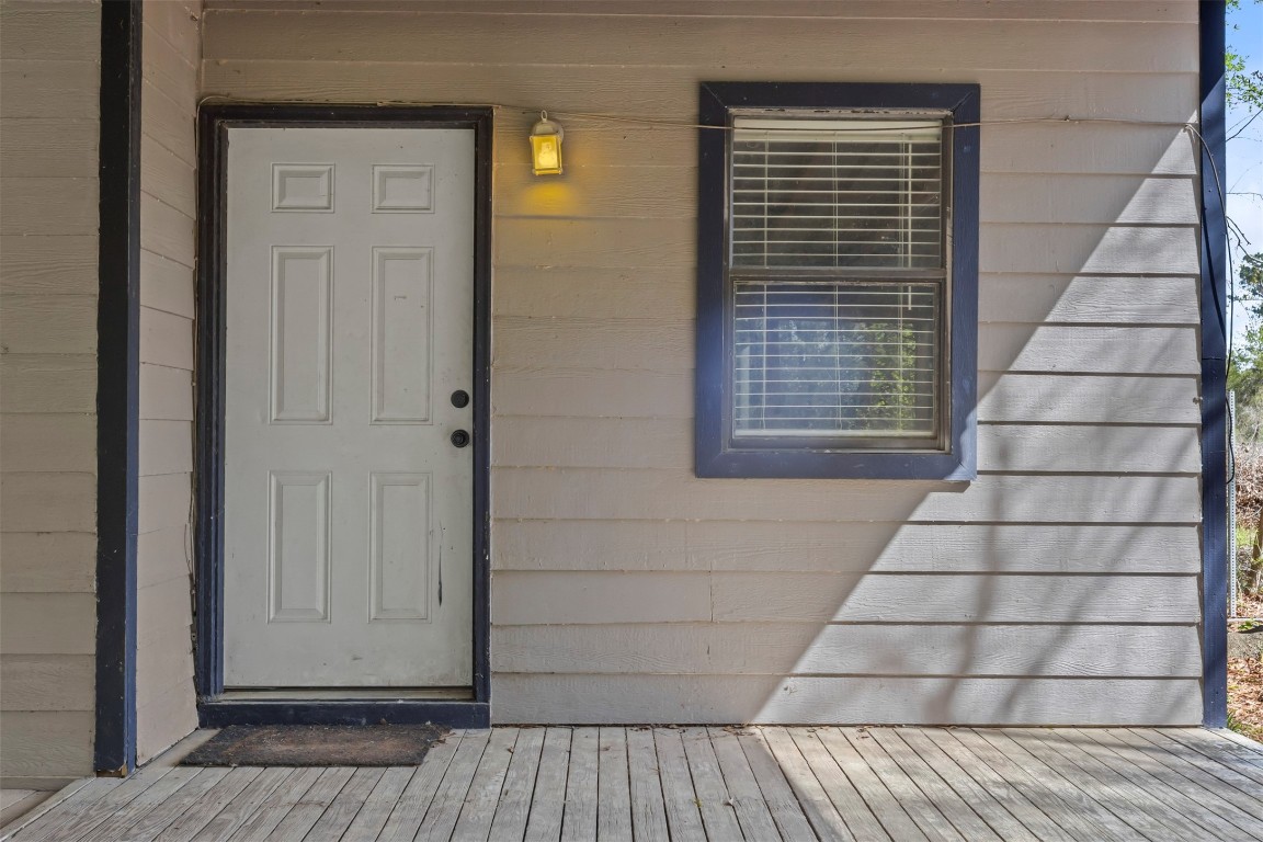 801 Campbell Acres Road Cleveland, TX 77328 - Photo 3 of 36 a view of wooden door and outdoor space