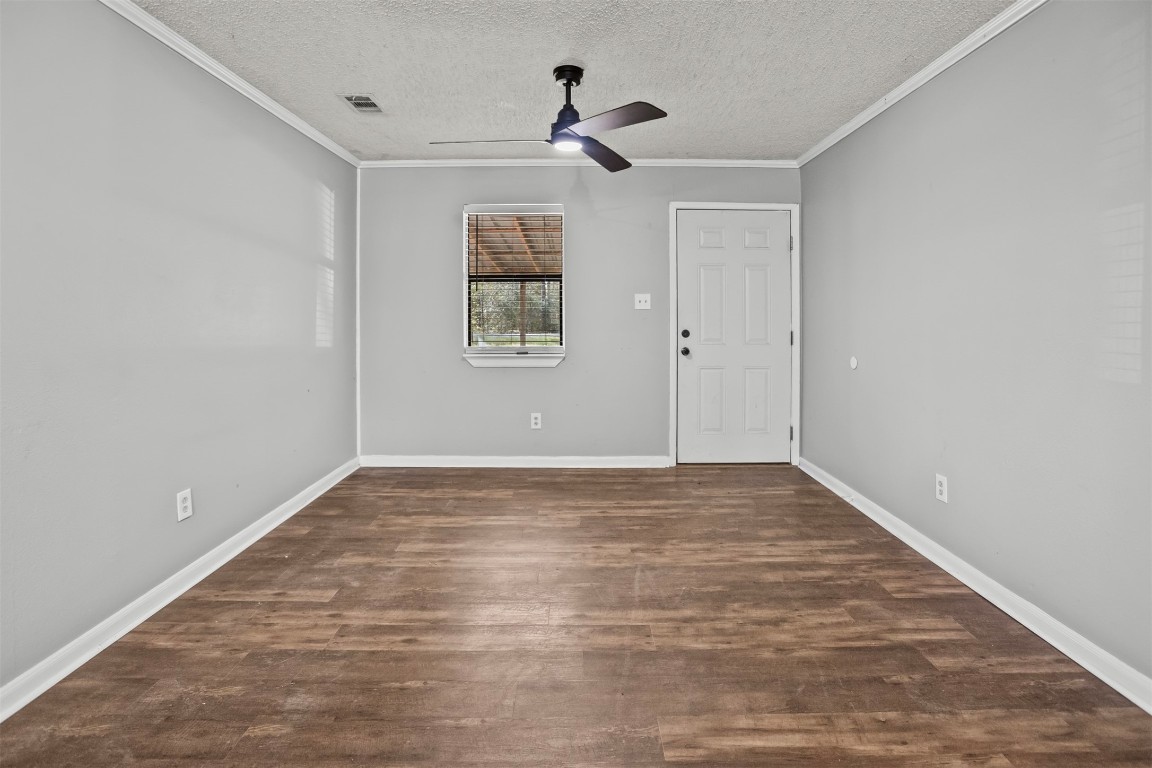 801 Campbell Acres Road Cleveland, TX 77328 - Photo 4 of 36 a view of an empty room with a window