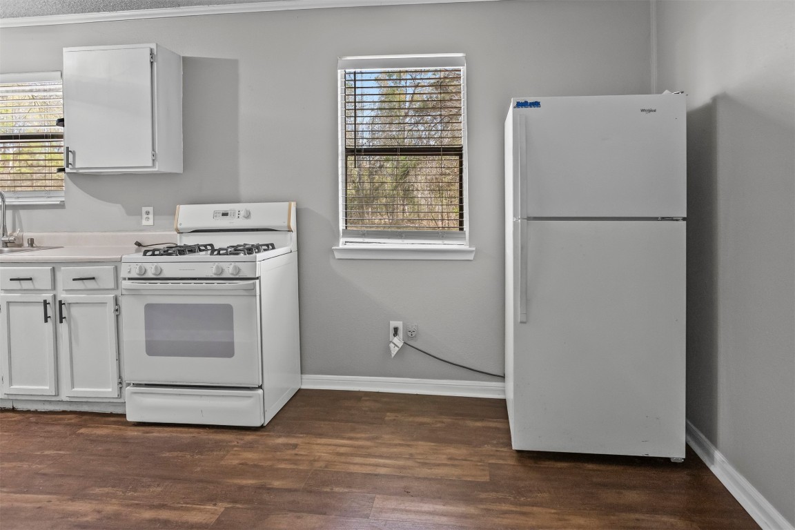 801 Campbell Acres Road Cleveland, TX 77328 - Photo 7 of 36 a white refrigerator freezer sitting inside of a kitchen