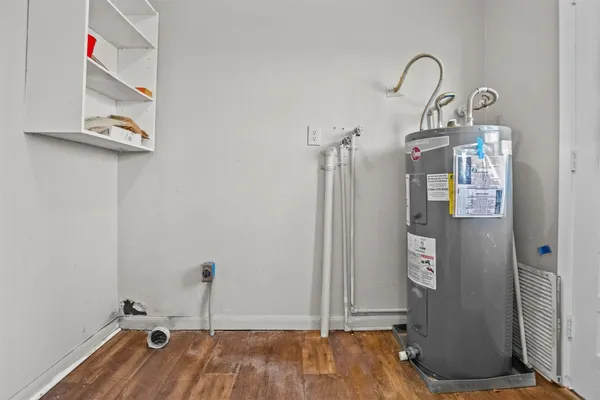 a view of a room with wooden floor