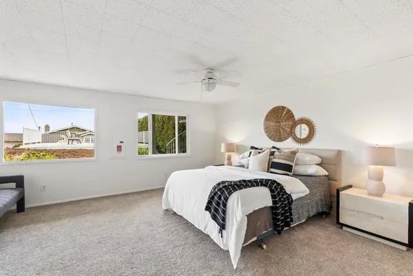 a bedroom with a bed and window