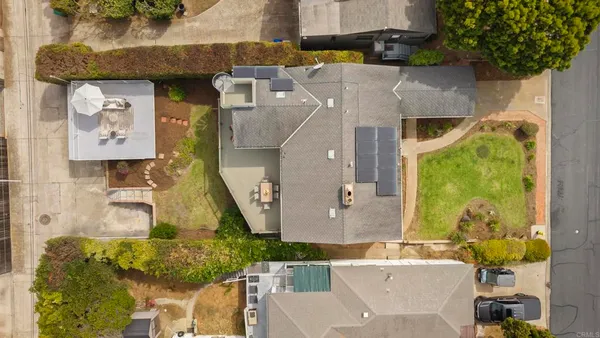 an aerial view of residential building with parking space