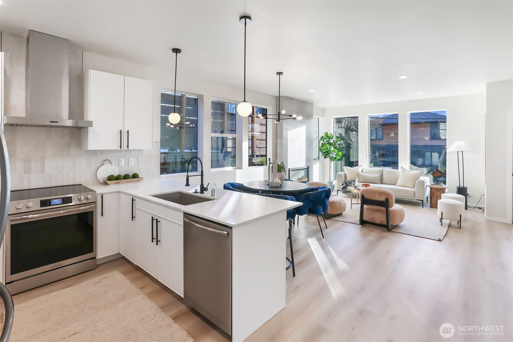 836 Northwest 50th Street Seattle, WA 98107 - Photo 11 of 35 a kitchen with stainless steel appliances granite countertop a sink and a stove