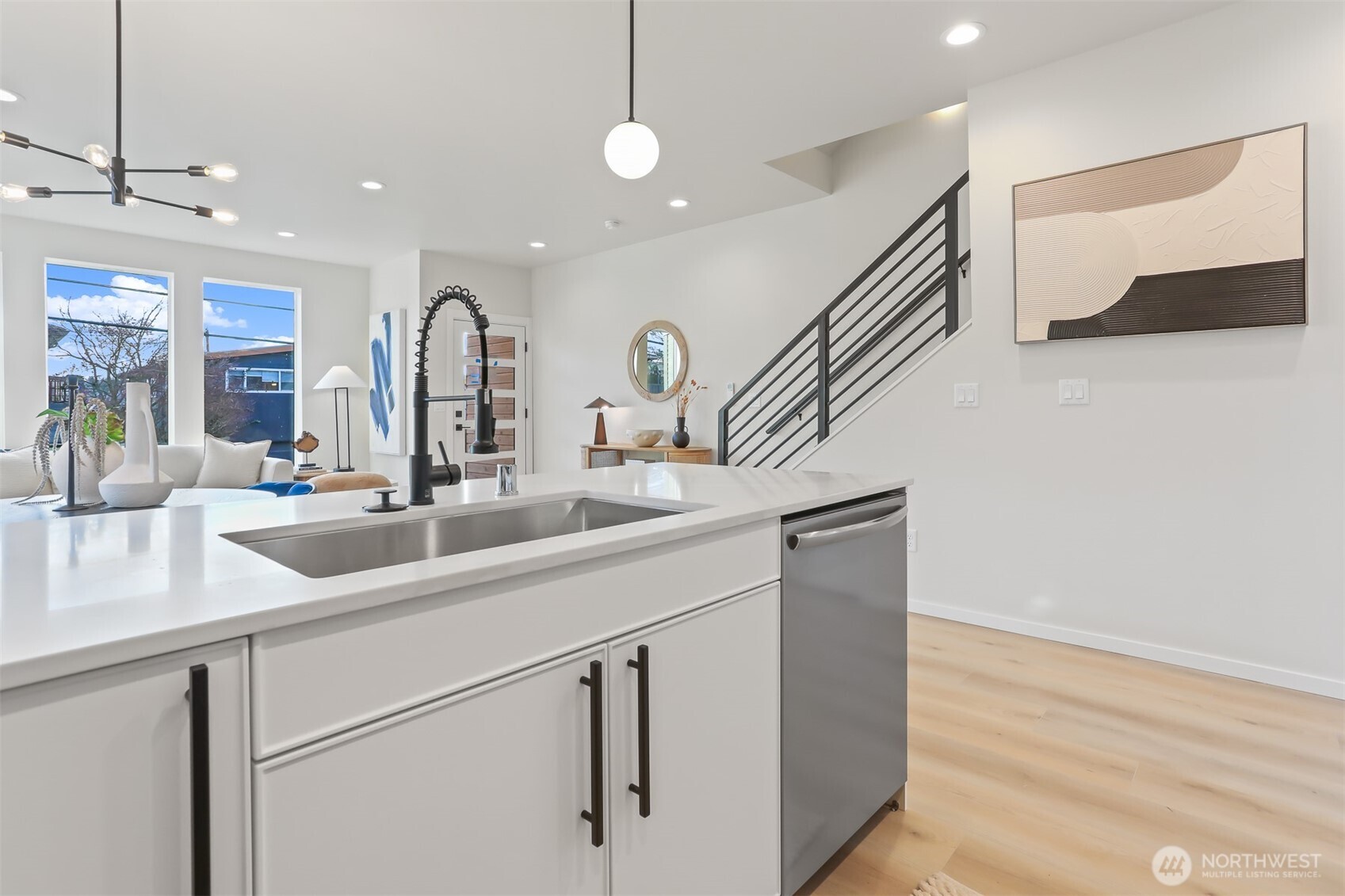836 Northwest 50th Street Seattle, WA 98107 - Photo 15 of 35 a kitchen with stainless steel appliances granite countertop a sink and a refrigerator