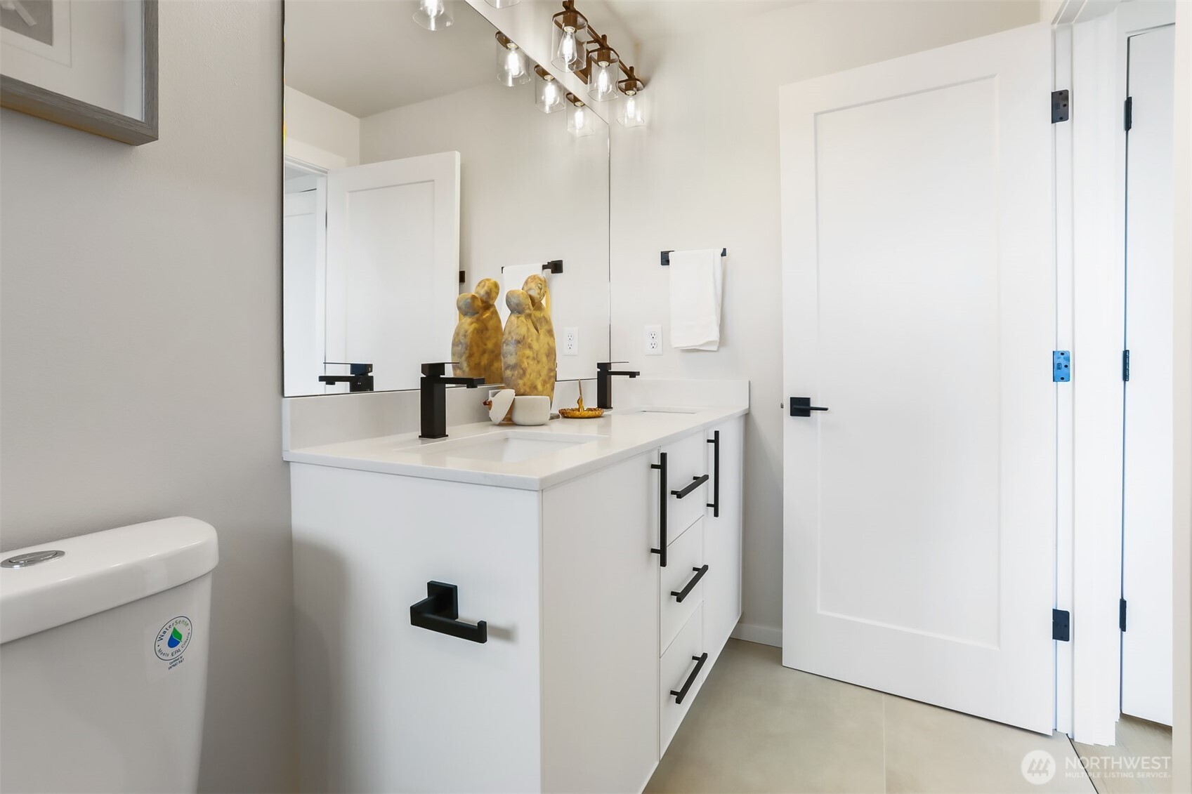 836 Northwest 50th Street Seattle, WA 98107 - Photo 20 of 35 a bathroom with a sink mirror vanity and toilet