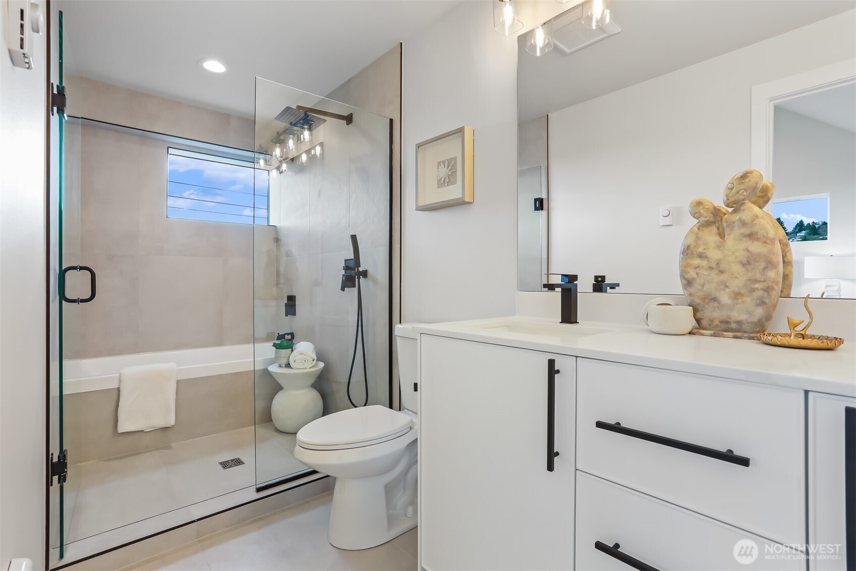 836 Northwest 50th Street Seattle, WA 98107 - Photo 21 of 35 a bathroom with a sink a toilet and shower