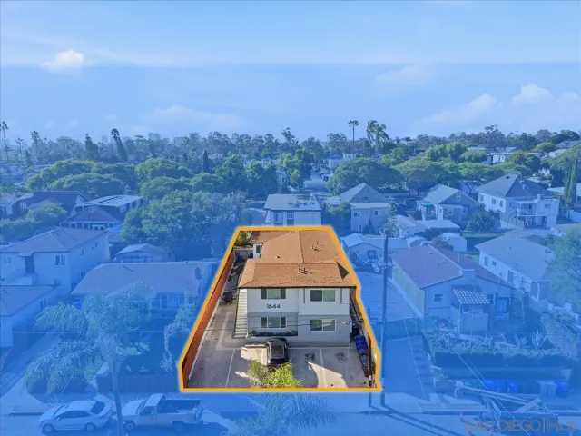 a view of a swimming pool with a yard and mountain view