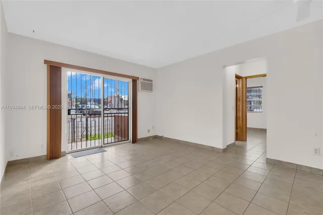 a kitchen with stainless steel appliances granite countertop a sink and a white cabinets