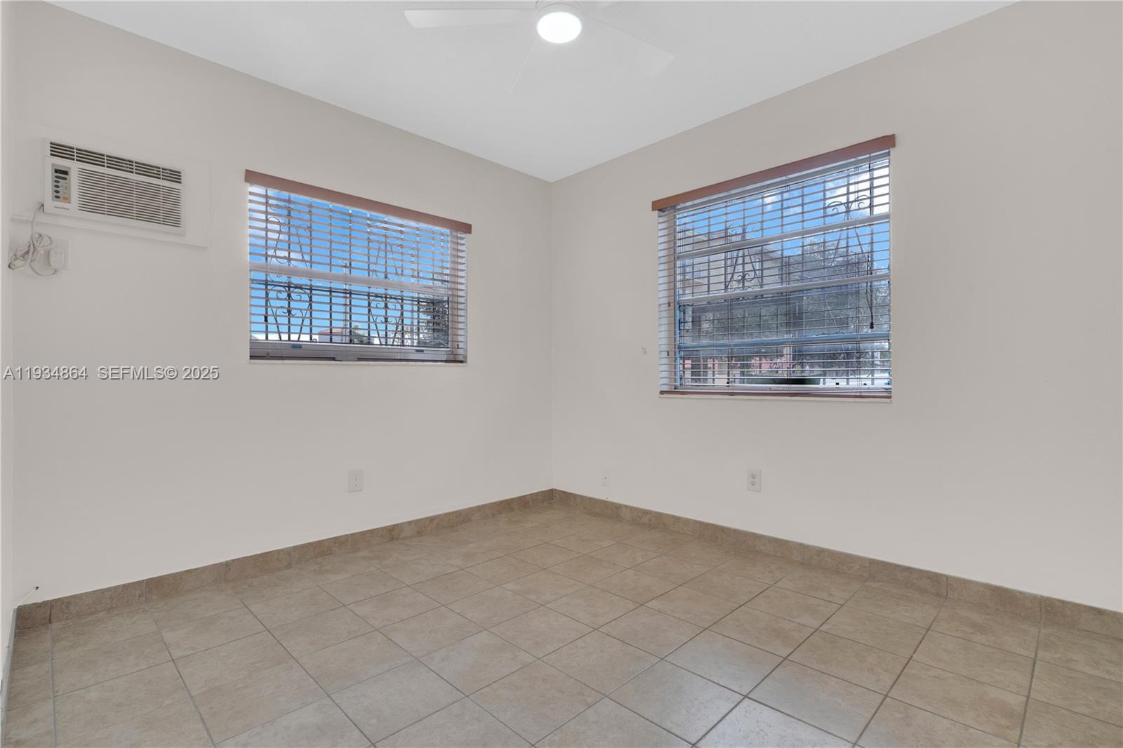 47 Northwest 47th Avenue, Unit 1 Miami, FL 33126 - Photo 9 of 14 a view of an empty room with a window