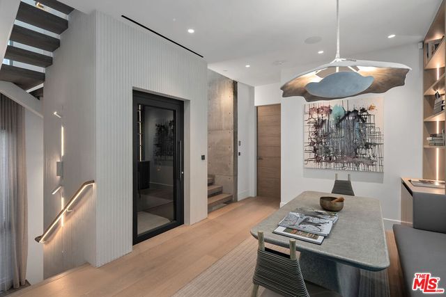 a bedroom with a large bed and a large window