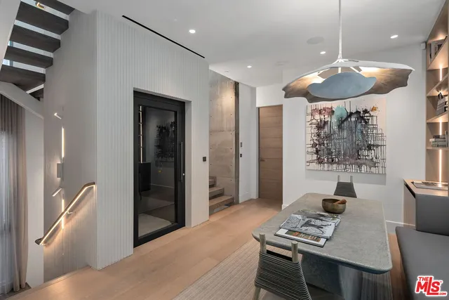 a bedroom with a large bed and a large window