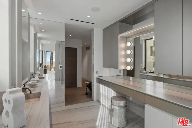 a bed room with a bed and a large window