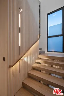 a bedroom with a bed and a table