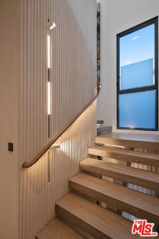 a bedroom with a bed and a table