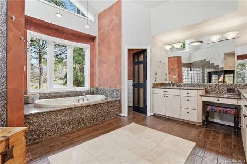 a kitchen with stainless steel appliances granite countertop a refrigerator and stove