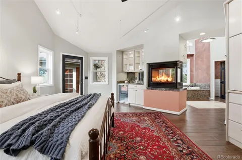 a spacious bedroom with a bed and a cabinets