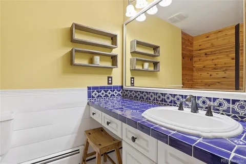 a bathroom with a bathtub and shower