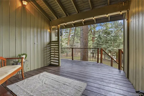 a view of a balcony with wooden floor
