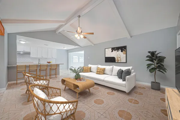 a living room with furniture a chandelier and a window