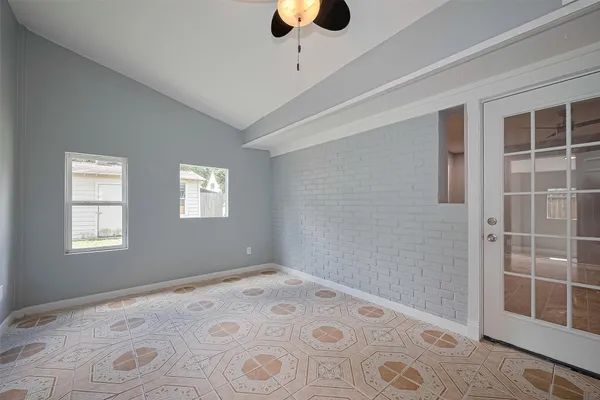 a view of an empty room with a window