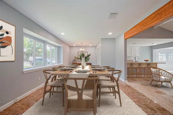 a view of a dining room with furniture window and outside view