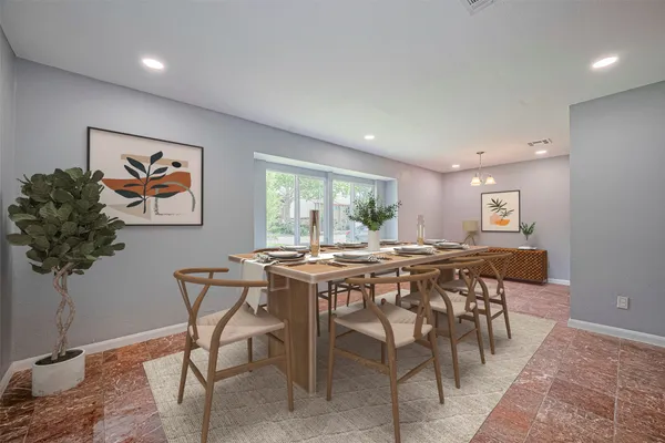 a view of a dining room with furniture