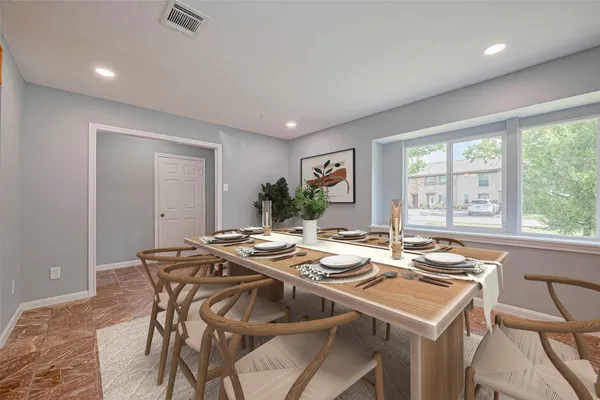 a view of a dining room with furniture window and outside view
