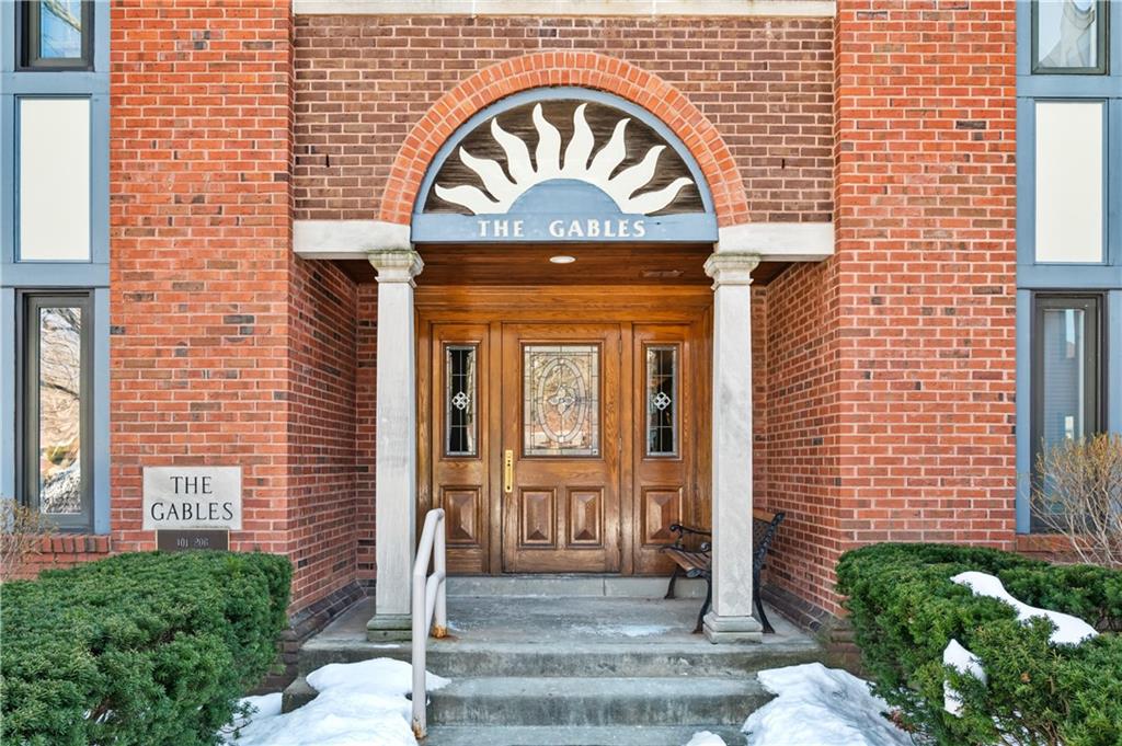 100 Denniston Street, Unit 304 Pittsburgh, PA 15206 - Photo 1 of 27 a front view of a house with a garden
