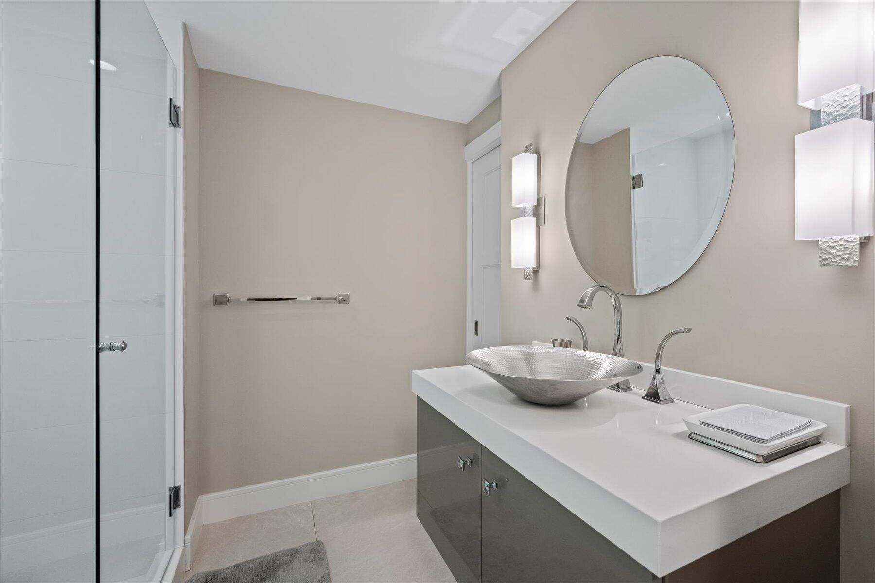 2500 South Ocean Boulevard, Unit 3A3 Palm Beach, FL 33480 - Photo 22 of 39 a bathroom with a sink and a mirror