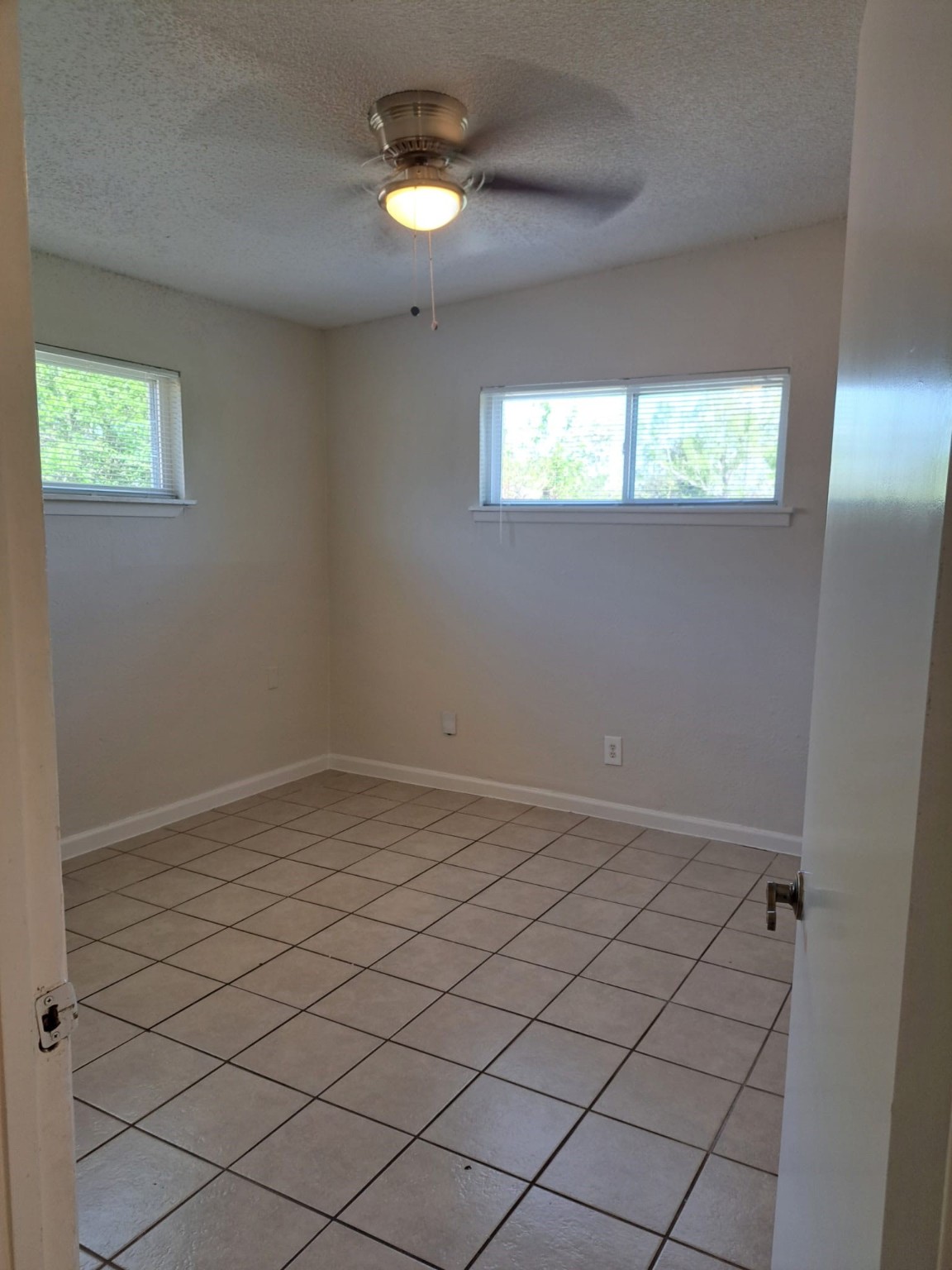 3357 Frick Road, Unit 3 Houston, TX 77086 - Photo 5 of 7 Bedroom 2, no carpet and ceiling fan.