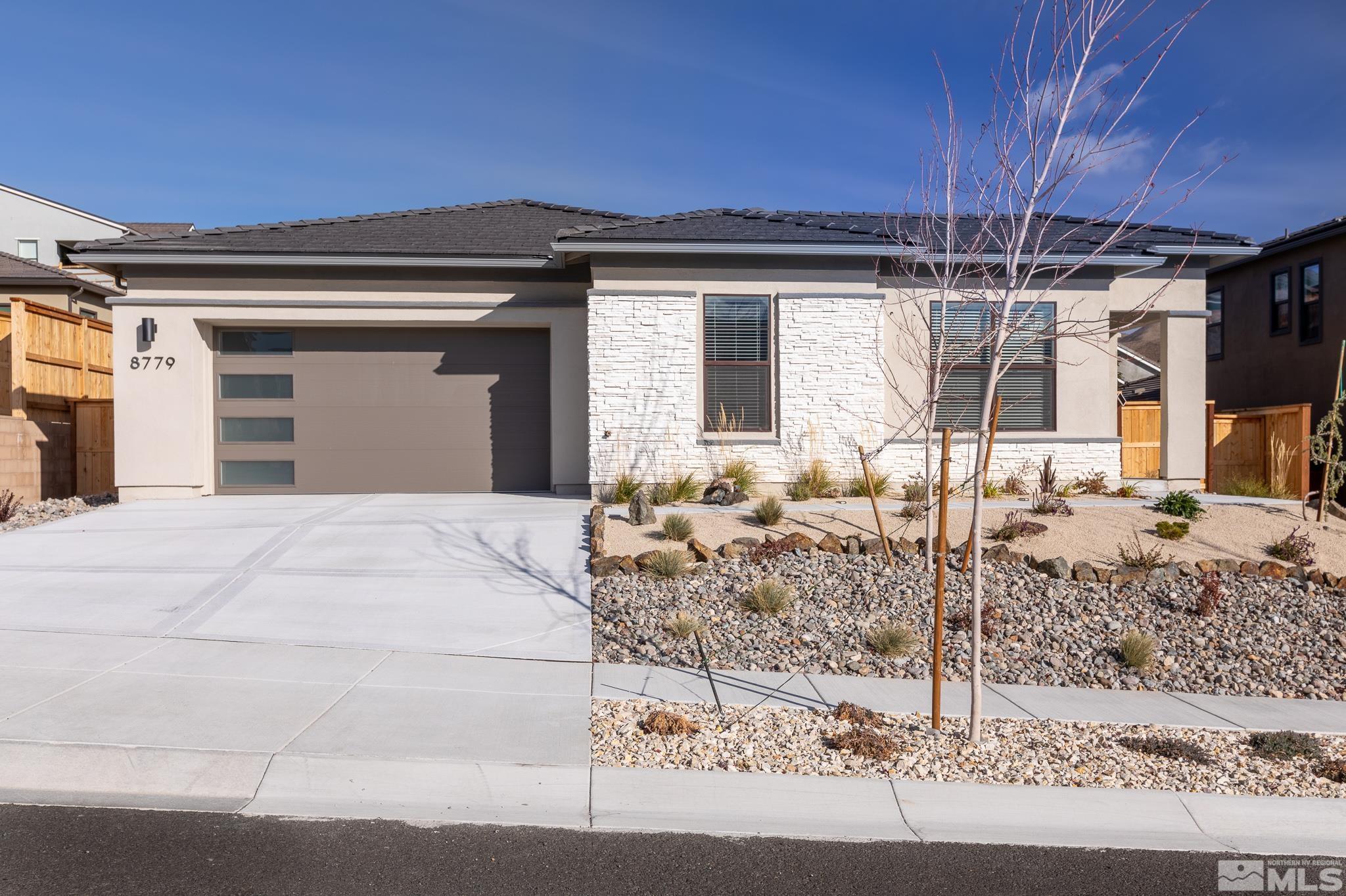 8779 Larkhaven Trail Reno, NV 89523 - Photo 1 of 32 a view of a house with a patio