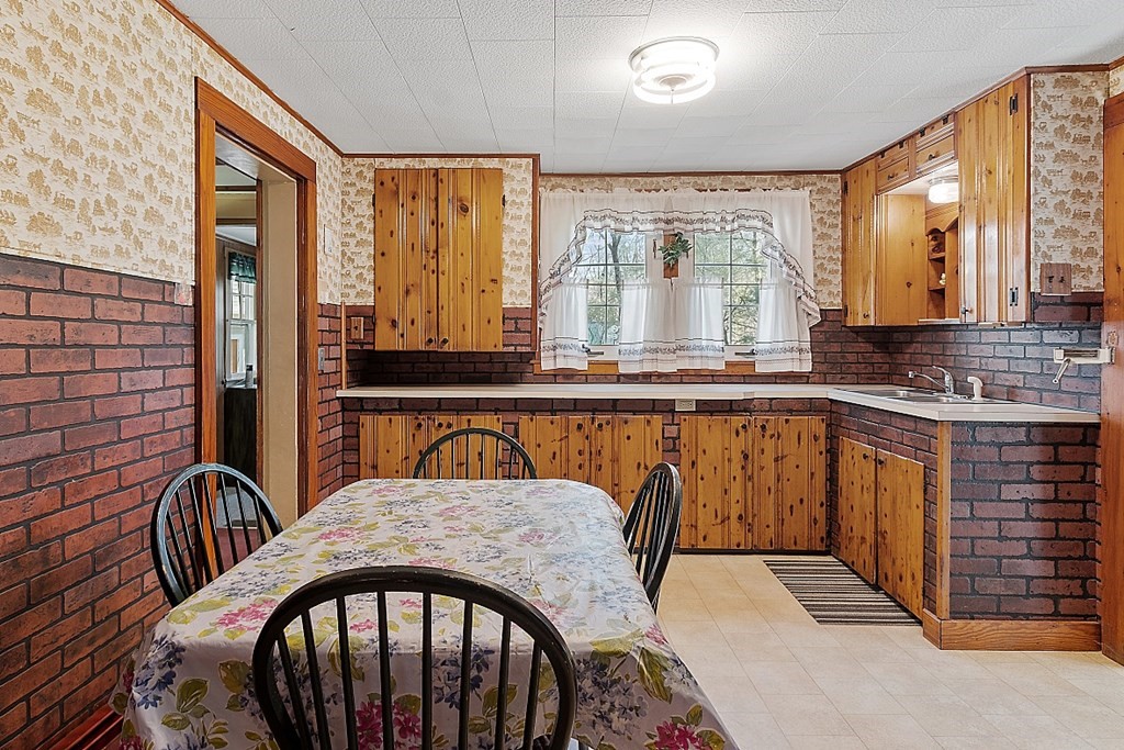 10 R Eagleville Road Orange, MA 01364 - Photo 12 of 29 a view of a kitchen with a sink and cabinets