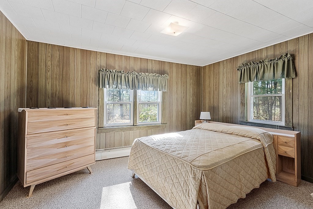 10 R Eagleville Road Orange, MA 01364 - Photo 22 of 29 a bedroom with a bed and a window