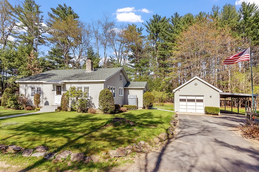 10 R Eagleville Road Orange, MA 01364 - Photo 3 of 29 a front view of a house with a garden