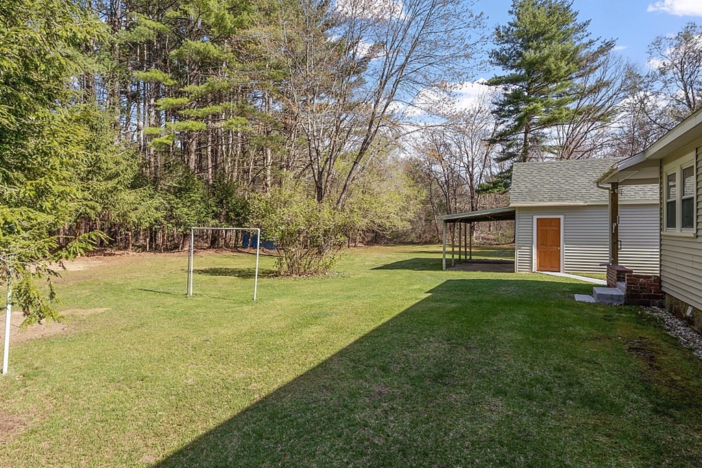 10 R Eagleville Road Orange, MA 01364 - Photo 5 of 29 a view of a house with swimming pool and a yard