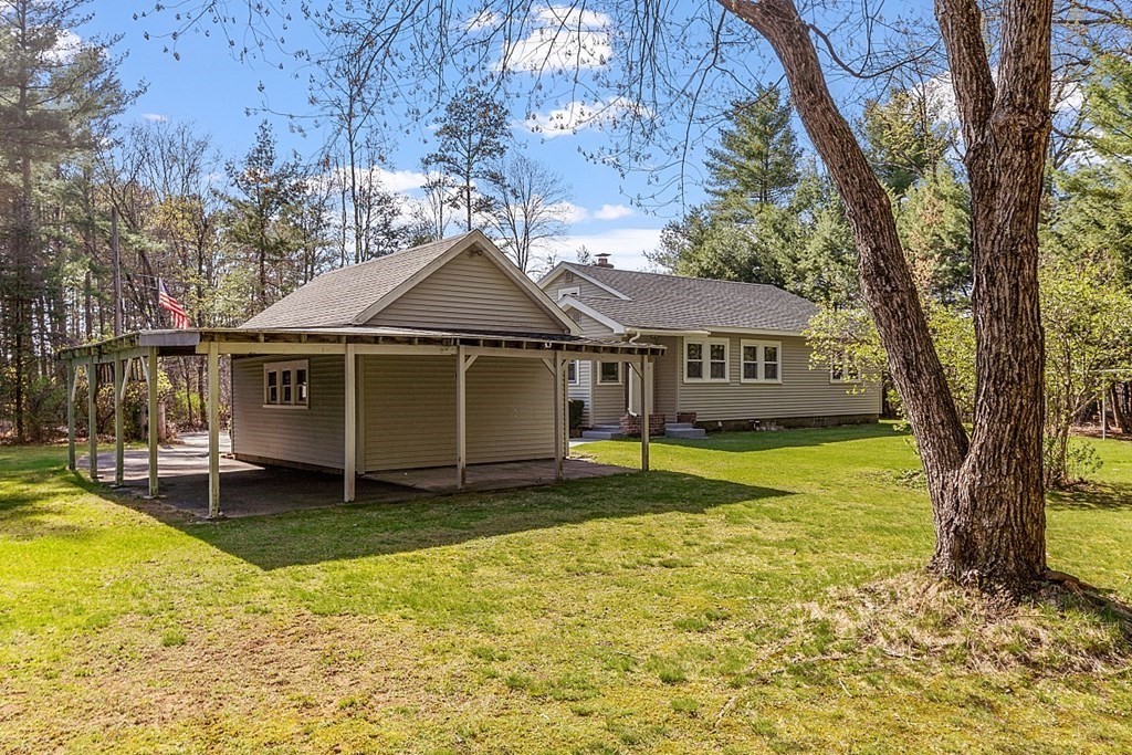 10 R Eagleville Road Orange, MA 01364 - Photo 6 of 29 a view of a house with a yard patio and a tree