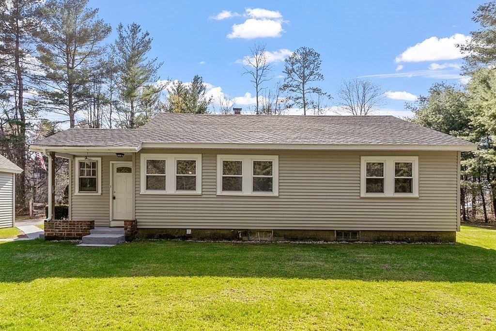 10 R Eagleville Road Orange, MA 01364 - Photo 7 of 29 a front view of a house with a garden
