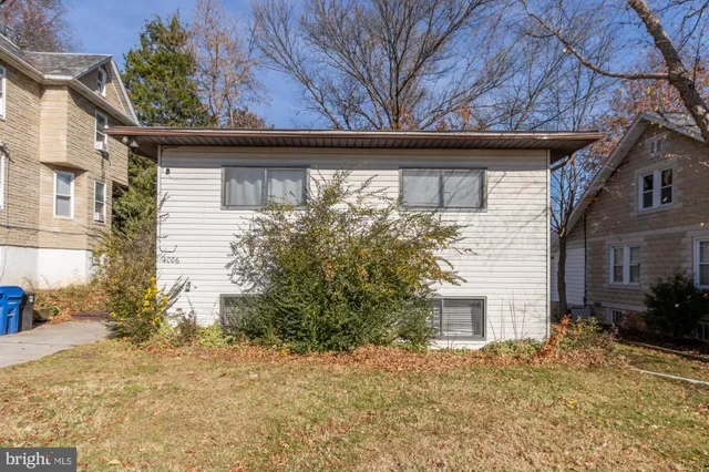 a view of a house with a tree