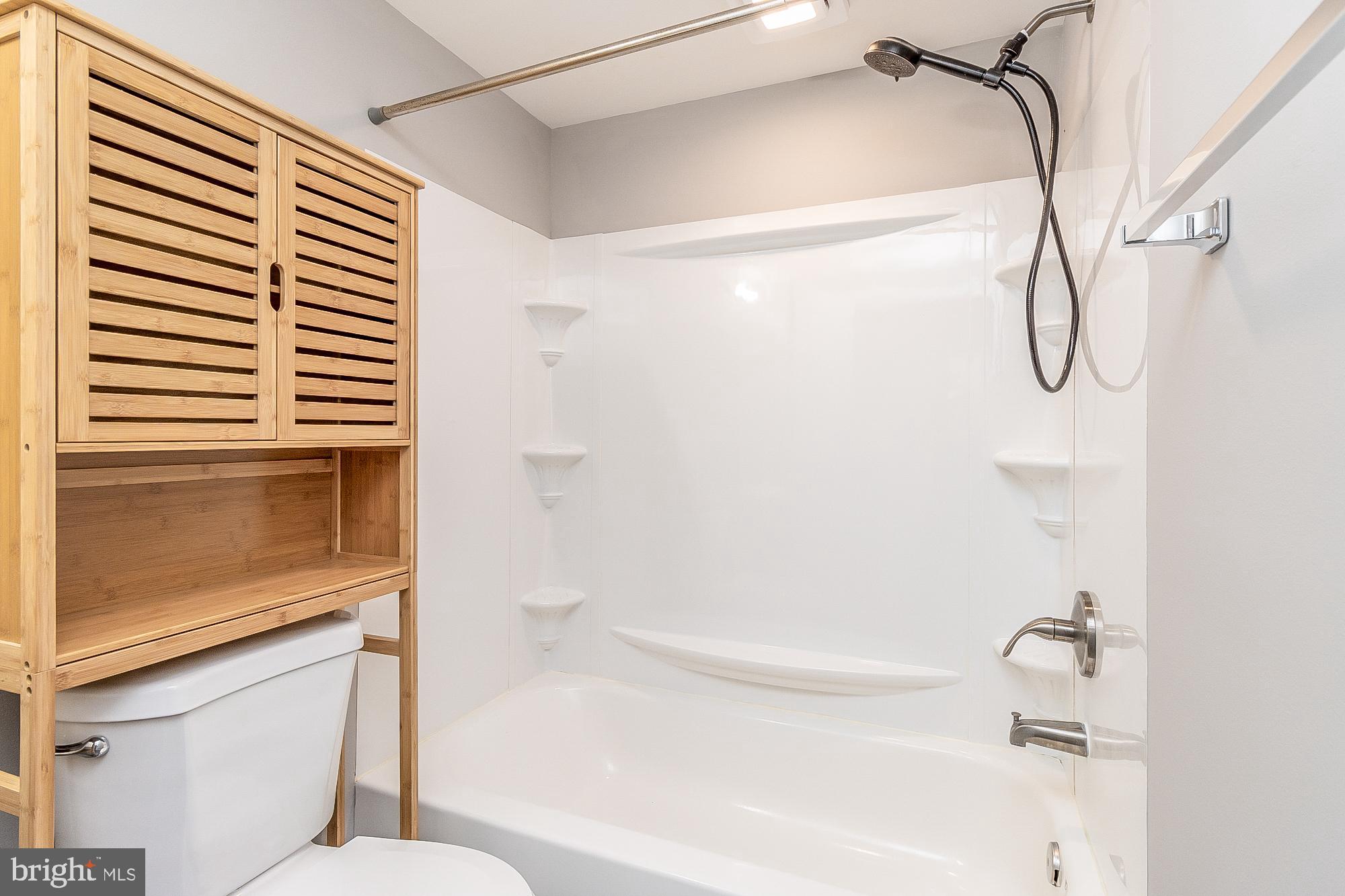 4006 Pinewood Avenue, Unit 1 Baltimore, MD 21206 - Photo 11 of 25 a bathroom with a shower and a toilet