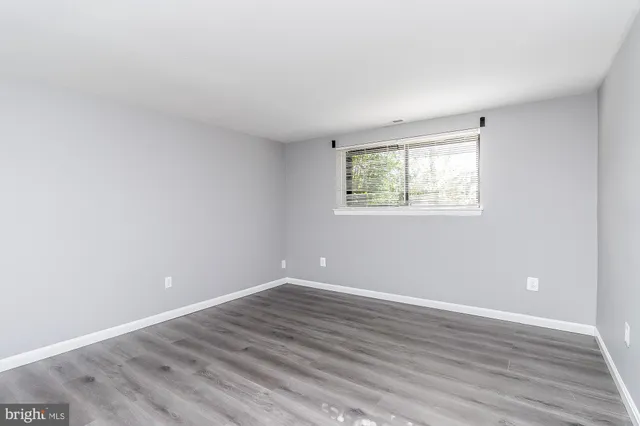 a view of room with wooden floor and windows in a room