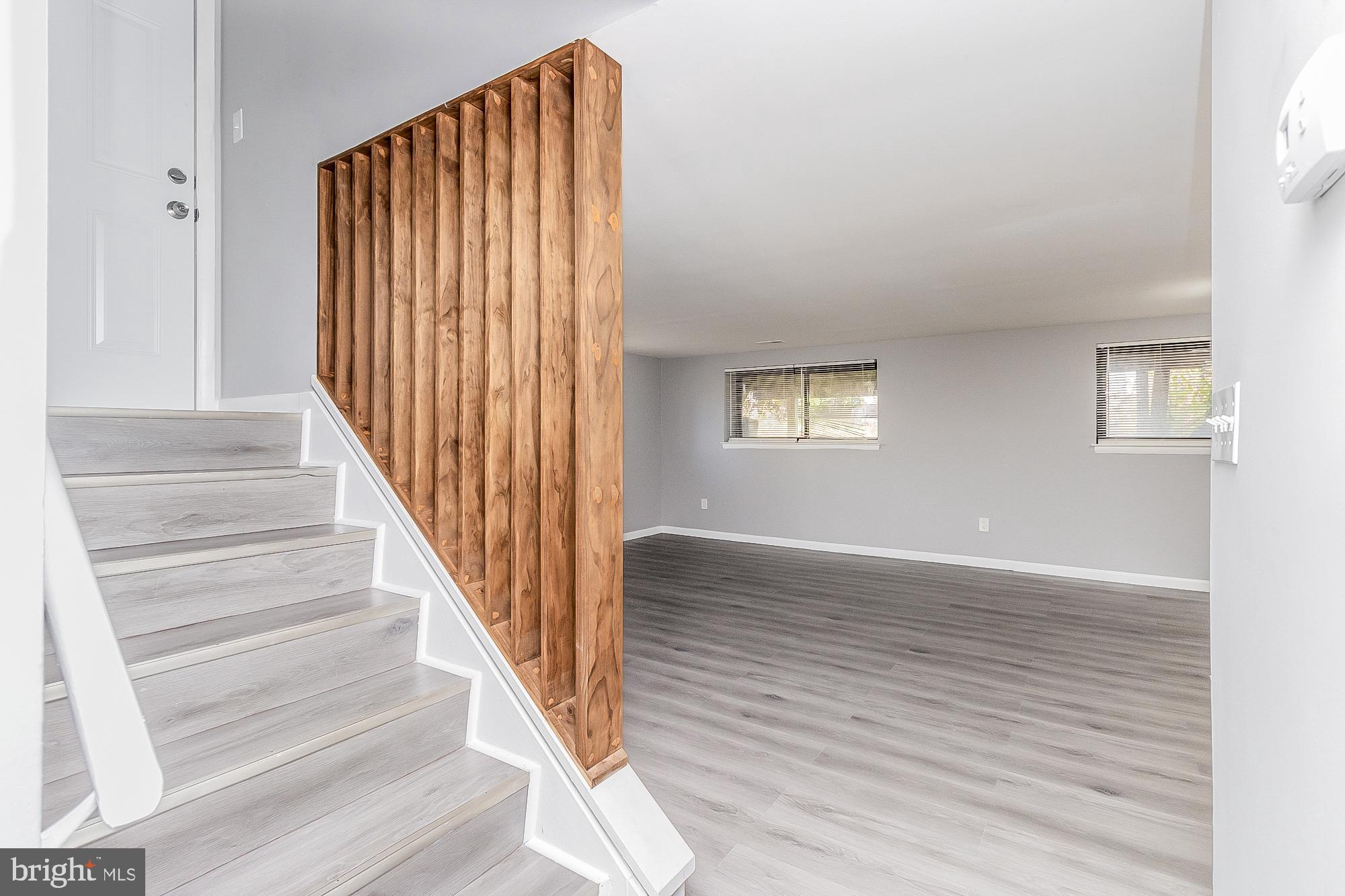 4006 Pinewood Avenue, Unit 1 Baltimore, MD 21206 - Photo 2 of 25 a view of entryway with wooden floor and front door