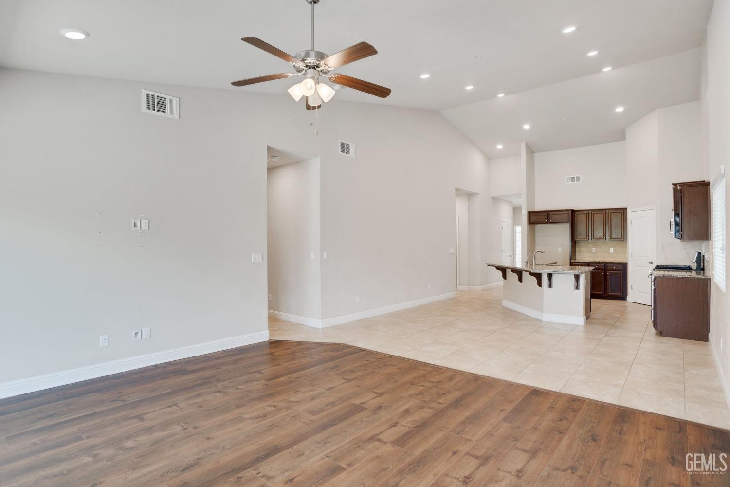 Undisclosed Address Bakersfield, CA 93311 - Photo 11 of 39 a view of kitchen with sink microwave and refrigerator