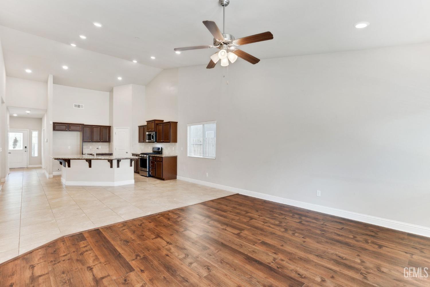 Undisclosed Address Bakersfield, CA 93311 - Photo 22 of 39 a view of kitchen with microwave and refrigerator