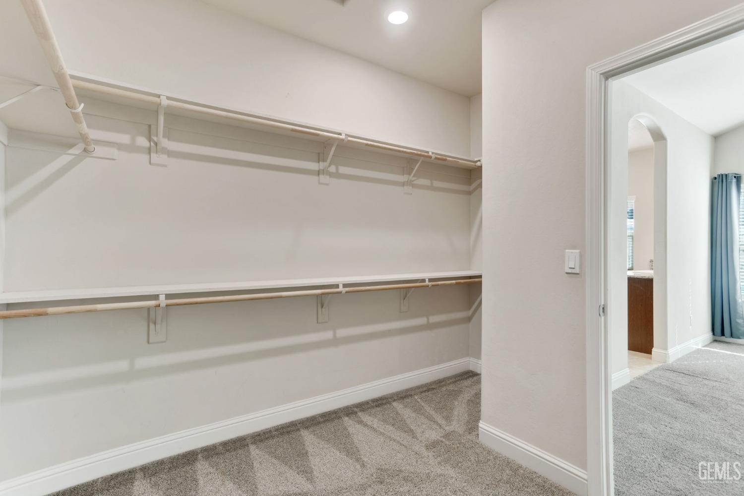Undisclosed Address Bakersfield, CA 93311 - Photo 26 of 39 a view of an empty walk in closet