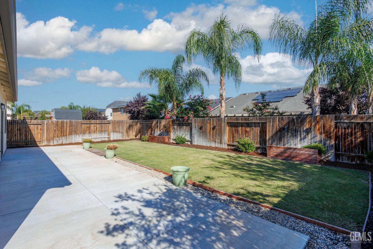 Undisclosed Address Bakersfield, CA 93311 - Photo 39 of 39 a view of a swimming pool with a garden