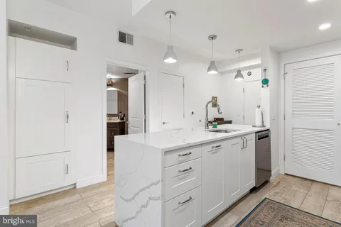 a bathroom with a double vanity sink and mirror