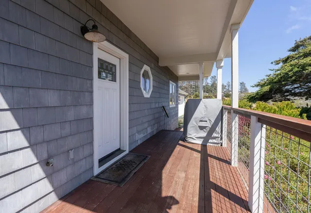 a view of balcony with furniture