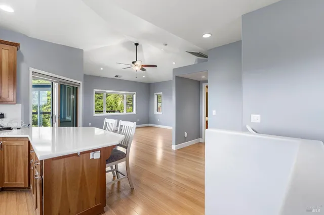 a view of a dining room with furniture and window
