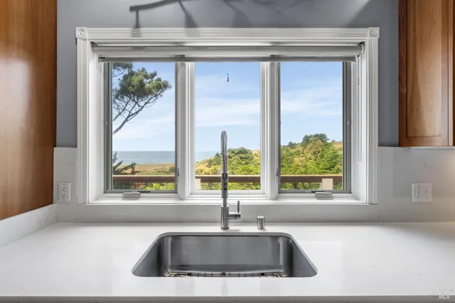 a kitchen sink sitting next to a window